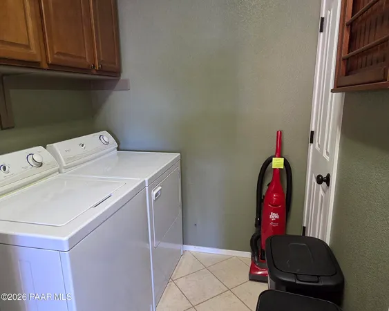 a view of storage and utility room with washer and dryer