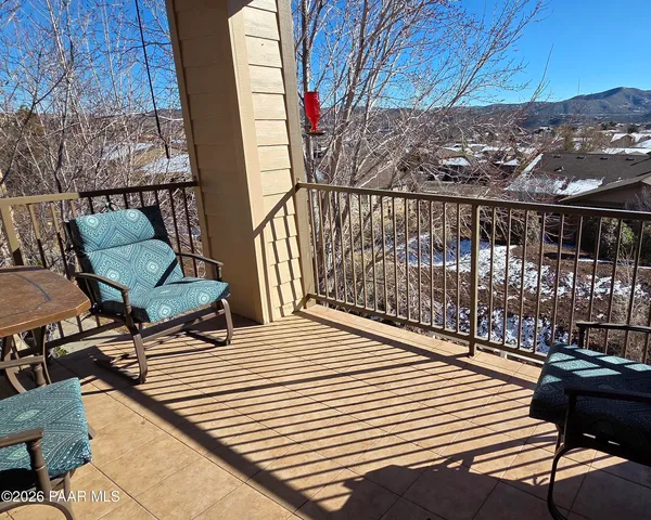 a view of balcony with wooden floor