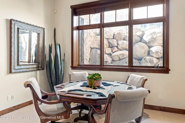 a dining room with furniture and window