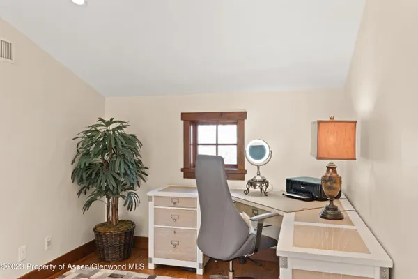 a view of a workspace with furniture