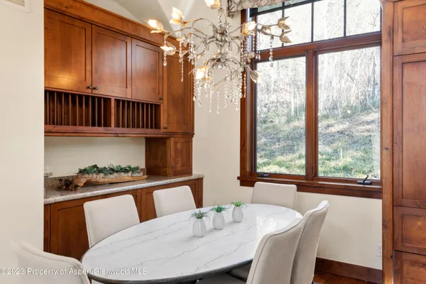 a view of a dining room with furniture window and outside view