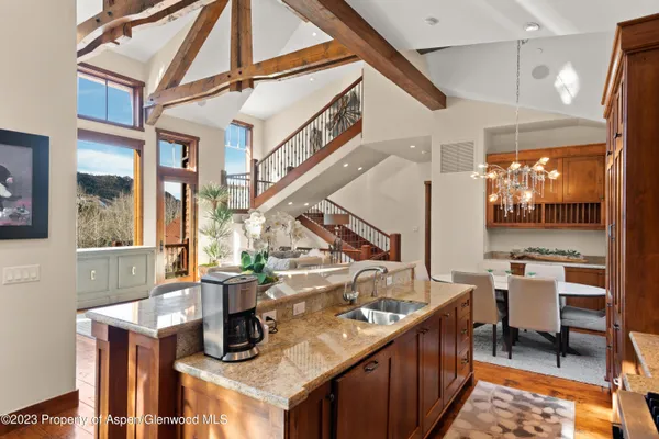 a view of a kitchen with furniture and a kitchen