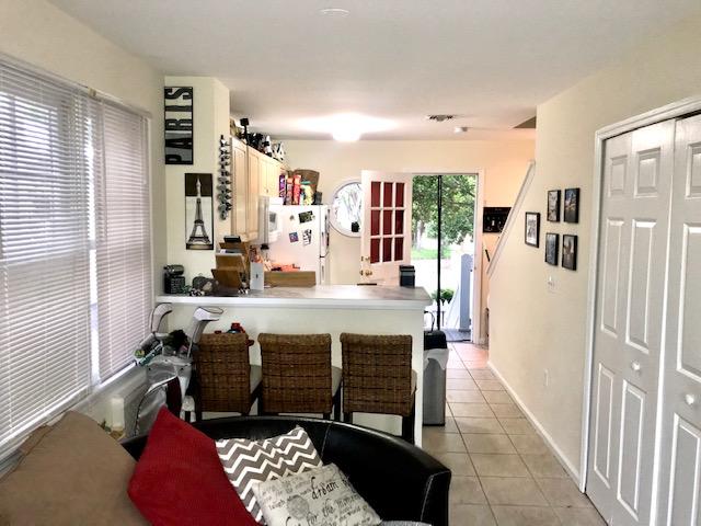 20 Merganser Lane Key West, FL 33040 - Photo 2 of 13 a room with table chairs and window