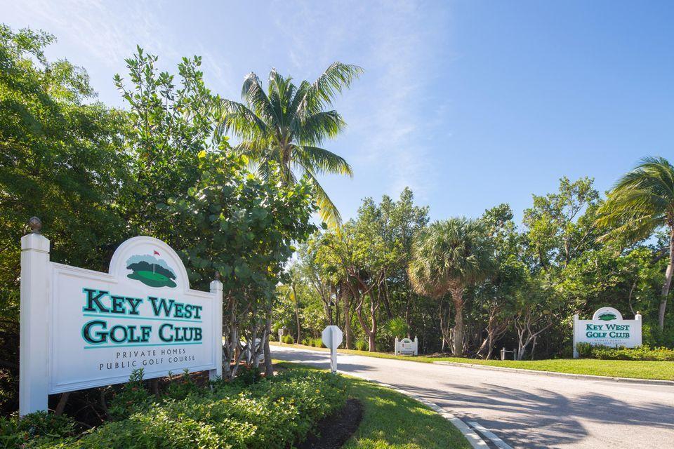 20 Merganser Lane Key West, FL 33040 - Photo 13 of 13 a view of a sign on a sidewalk next to a road
