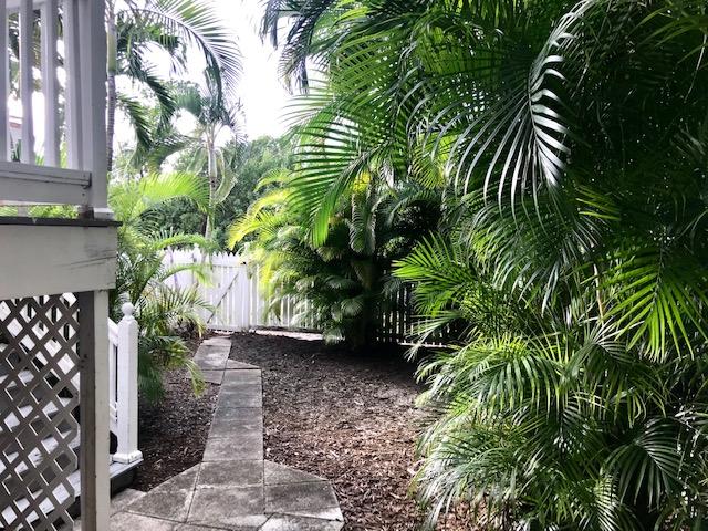 20 Merganser Lane Key West, FL 33040 - Photo 7 of 13 a view of backyard with plants and outdoor seating