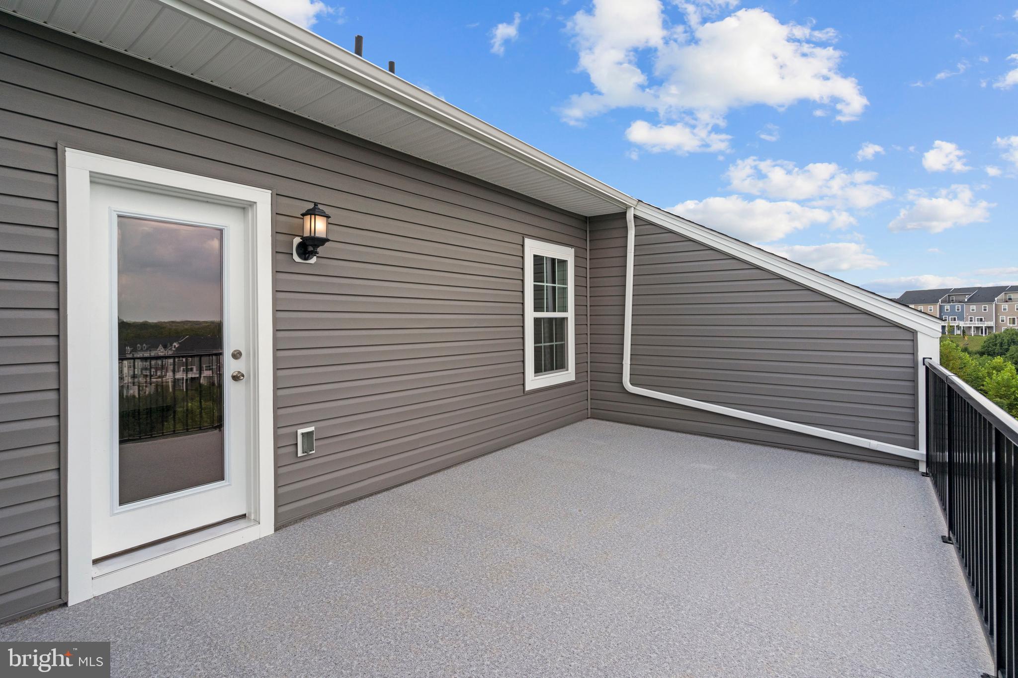 518 Downswing Road Baltimore, MD 21208 - Photo 7 of 9 a view of an empty room with a balcony