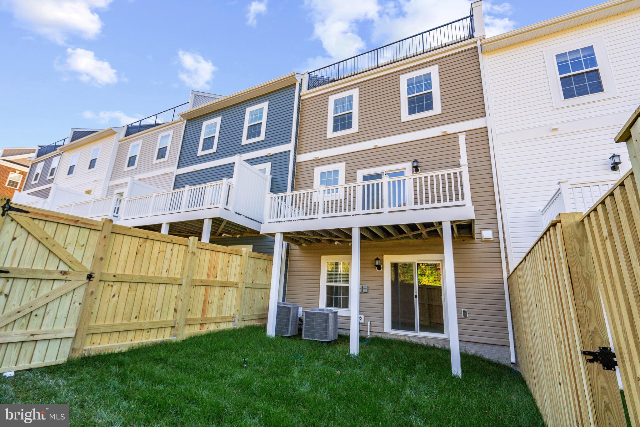 518 Downswing Road Baltimore, MD 21208 - Photo 8 of 9 a front view of a house with a garden