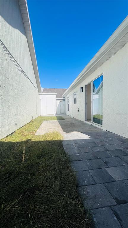 1613 Winter Green Boulevard Winter Park, FL 32792 - Photo 17 of 22 a view of a big room with wooden floor and windows