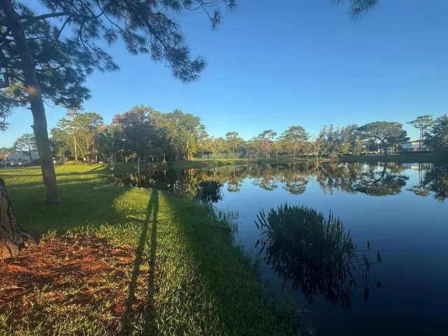 a view of lake with green space
