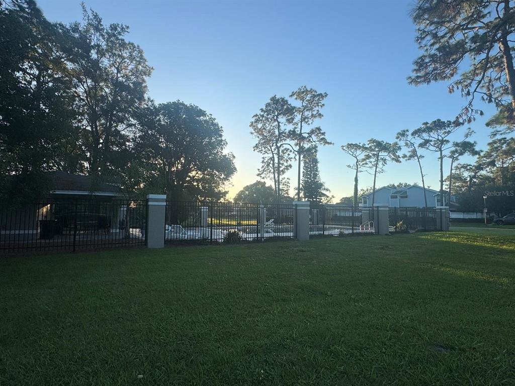 1613 Winter Green Boulevard Winter Park, FL 32792 - Photo 22 of 22 a backyard of a house with table and chairs