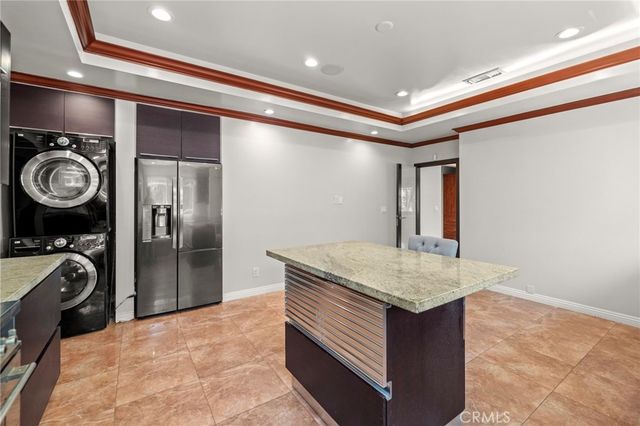 a kitchen with a stove and a refrigerator