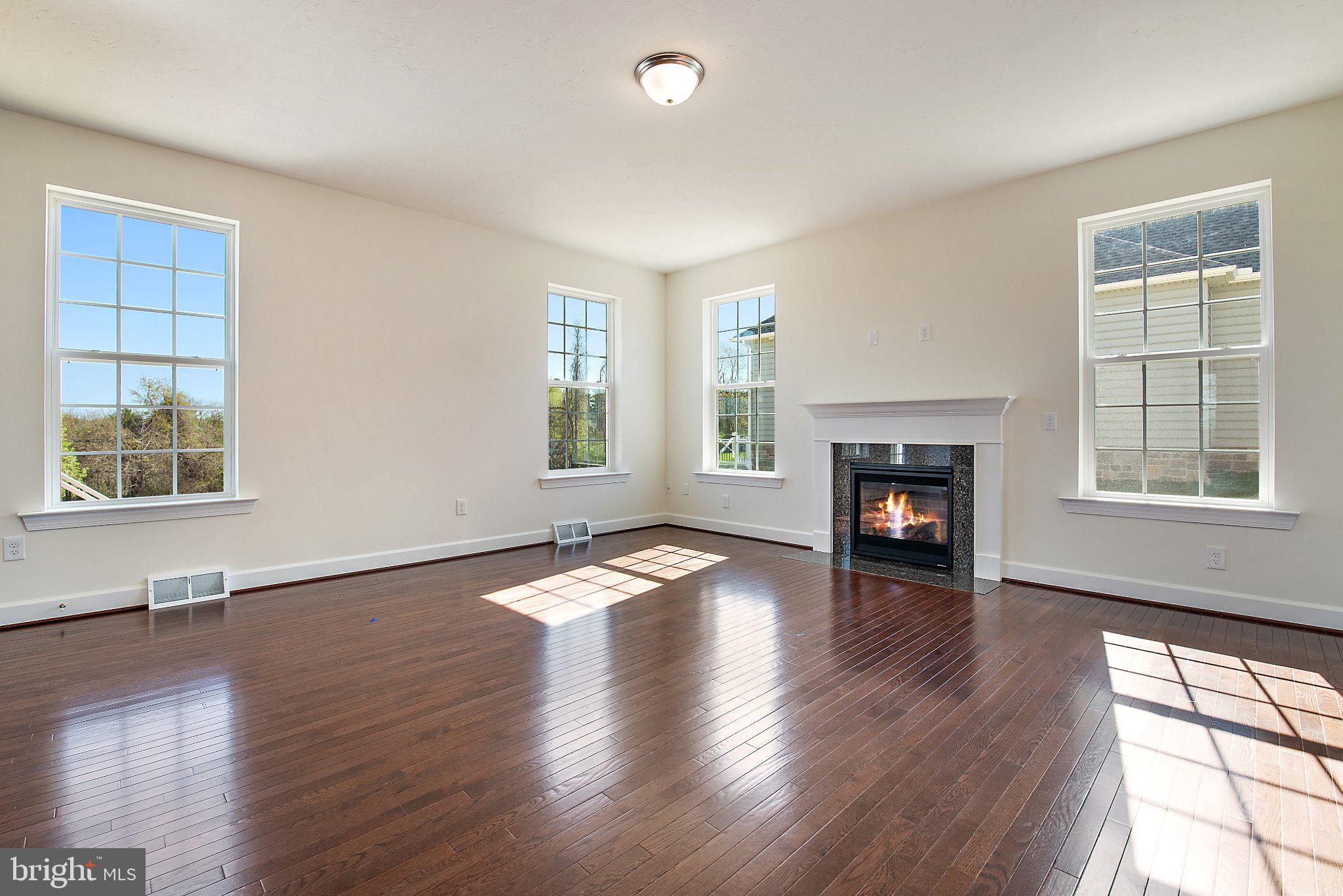 53 Bright Lane Hanover, PA 17331 - Photo 6 of 21 a view of an empty room with wooden floor and a window