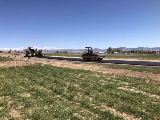 a view of a lake with houses in the back