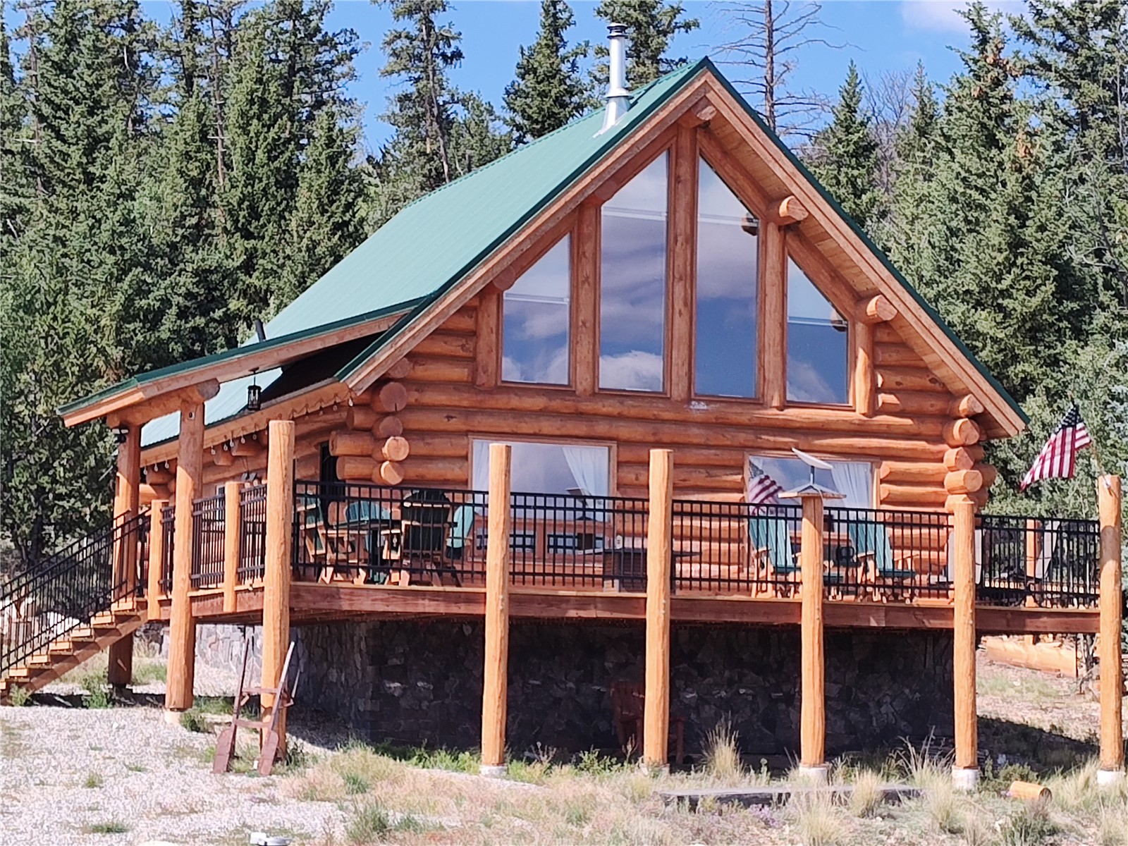 5 Arland Road Como, CO 80456 - Photo 1 of 33 a view of a house with wooden fence and large tree