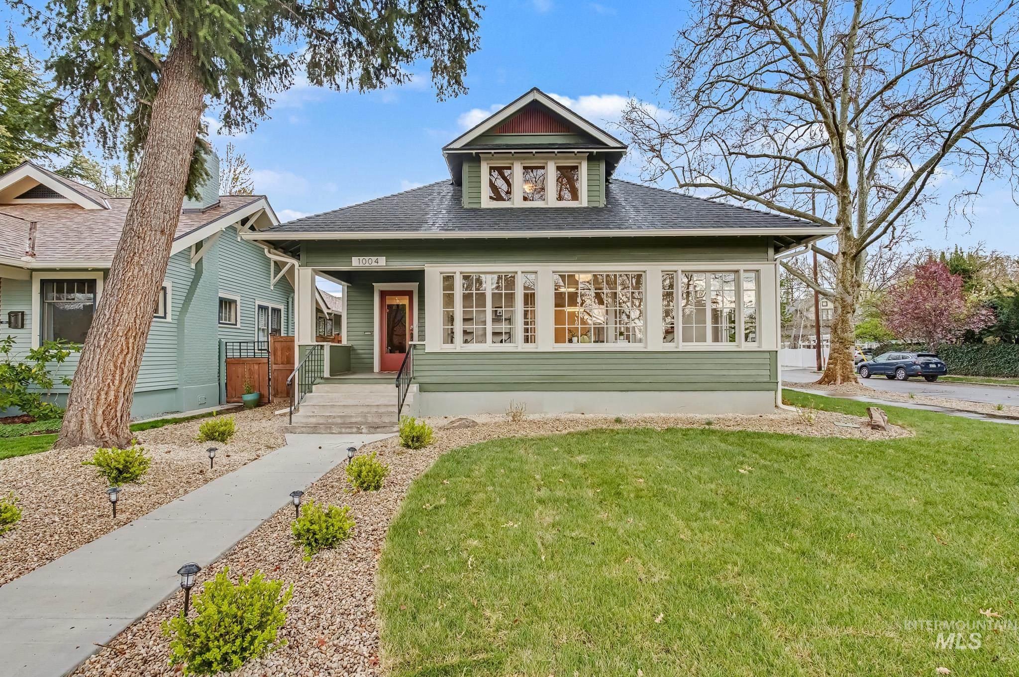1004 North 17th Street Boise, ID 83702 - Photo 1 of 1 View of front of property featuring a shingled roof, a front yard, and covered porch