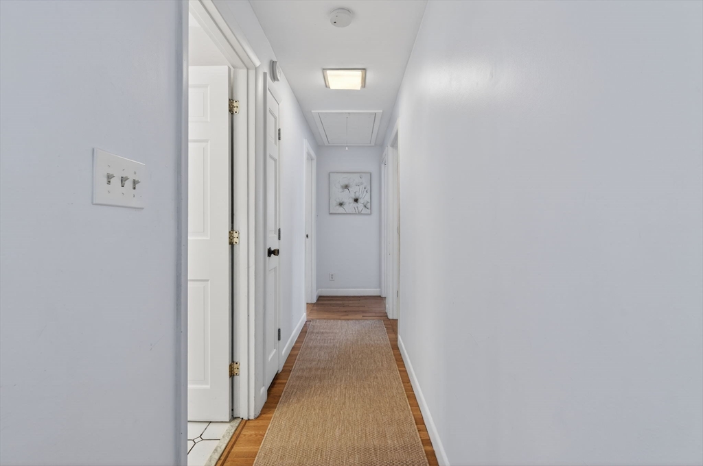 11 Rennie Drive Andover, MA 01810 - Photo 15 of 35 a view of a hallway with wooden floor