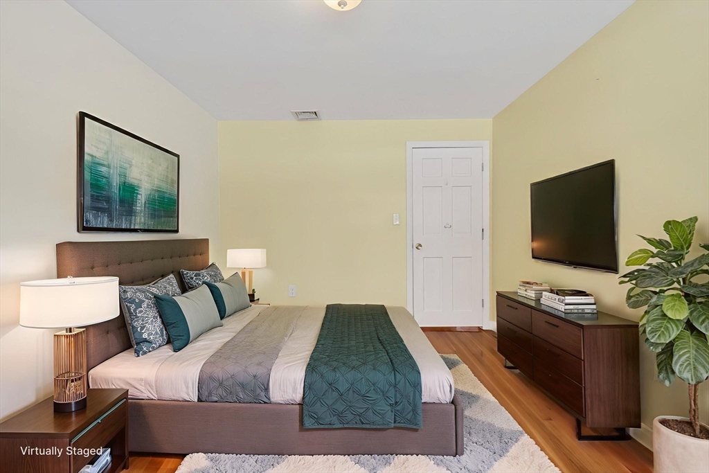11 Rennie Drive Andover, MA 01810 - Photo 19 of 35 a bedroom with a bed and a flat screen tv
