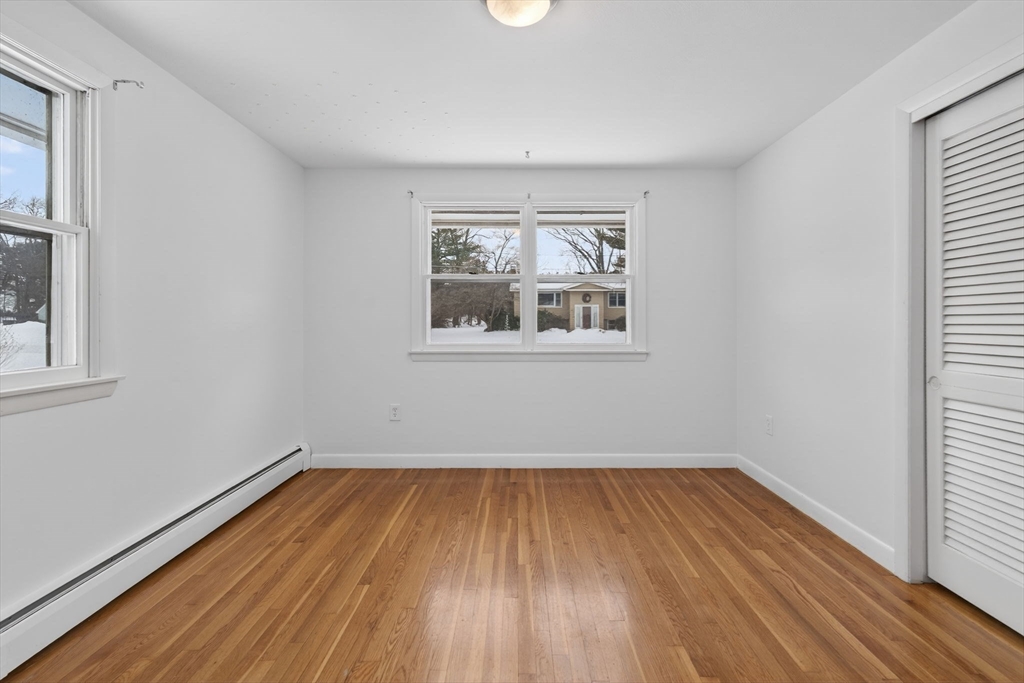 11 Rennie Drive Andover, MA 01810 - Photo 20 of 35 wooden floor in an empty room with a window