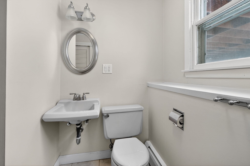 11 Rennie Drive Andover, MA 01810 - Photo 32 of 35 a bathroom with a toilet sink and mirror