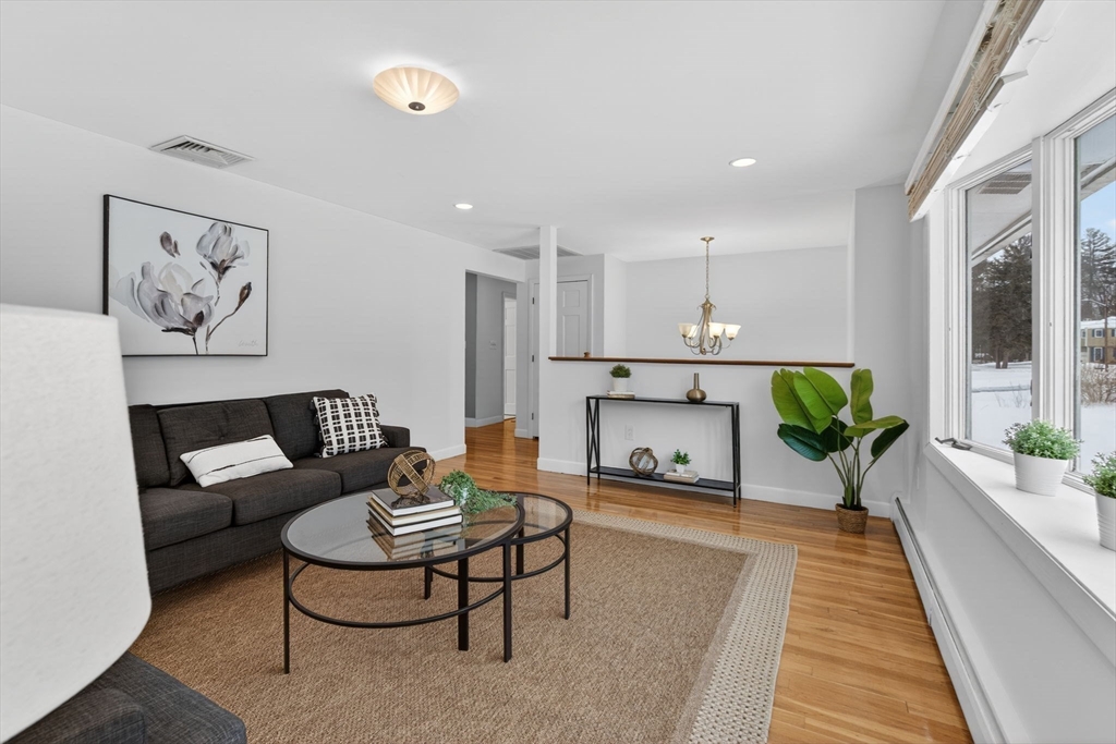 11 Rennie Drive Andover, MA 01810 - Photo 5 of 35 a living room with furniture and a rug