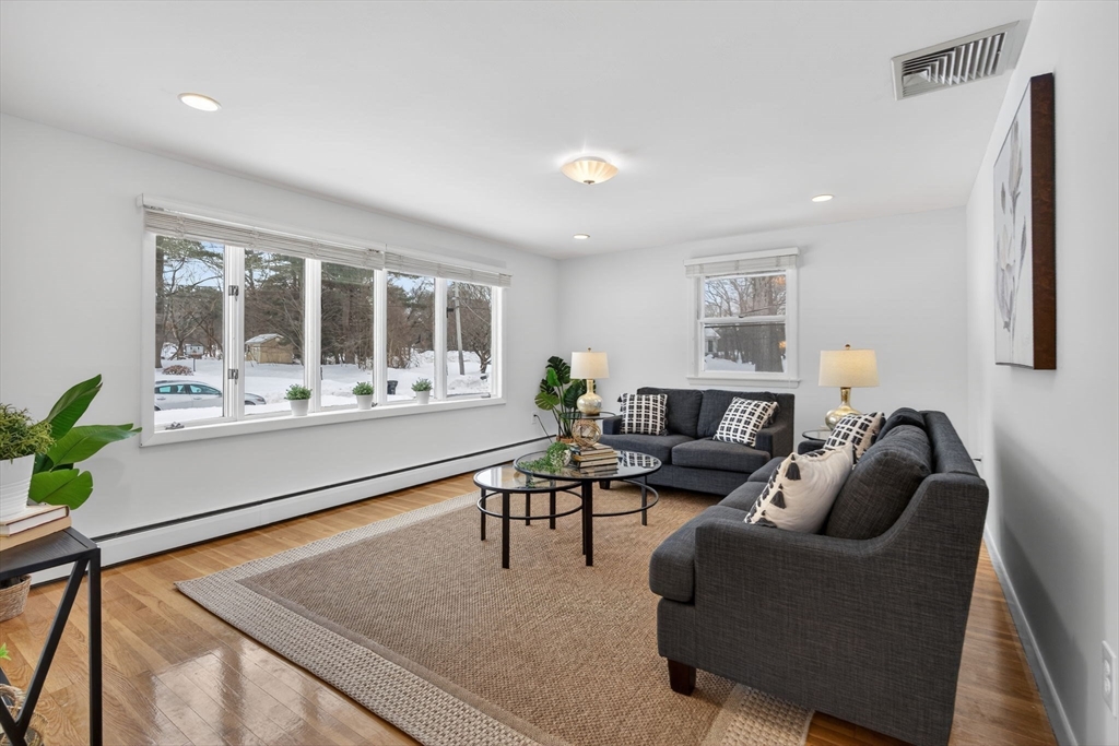 11 Rennie Drive Andover, MA 01810 - Photo 6 of 35 a living room with furniture and a large window