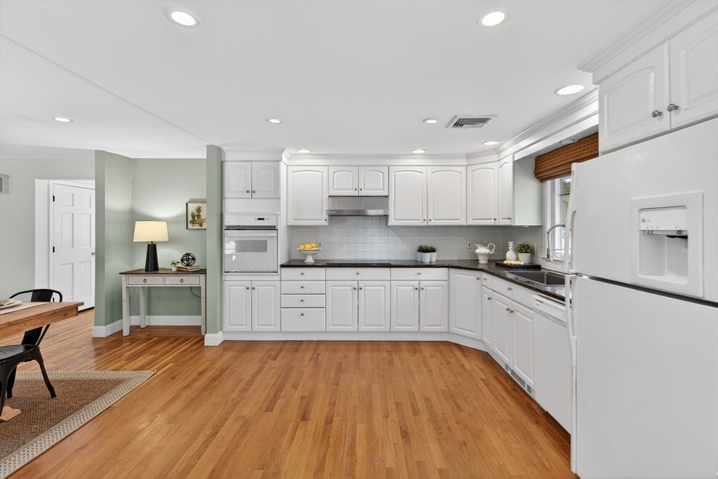 11 Rennie Drive Andover, MA 01810 - Photo 8 of 35 a kitchen with stainless steel appliances a refrigerator sink and cabinets