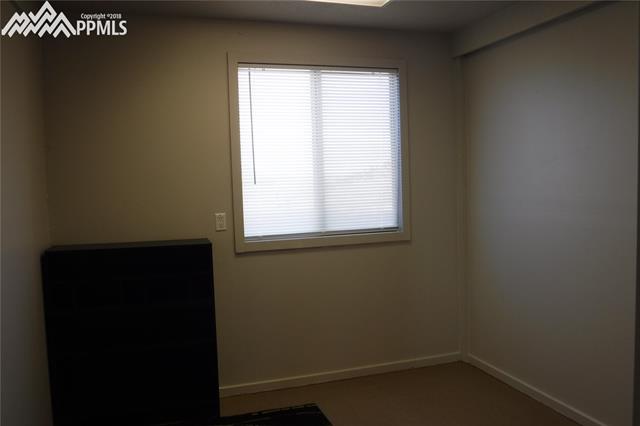 18425 Table Rock Road Colorado Springs, CO 80908 - Photo 8 of 19 Downstairs bedroom