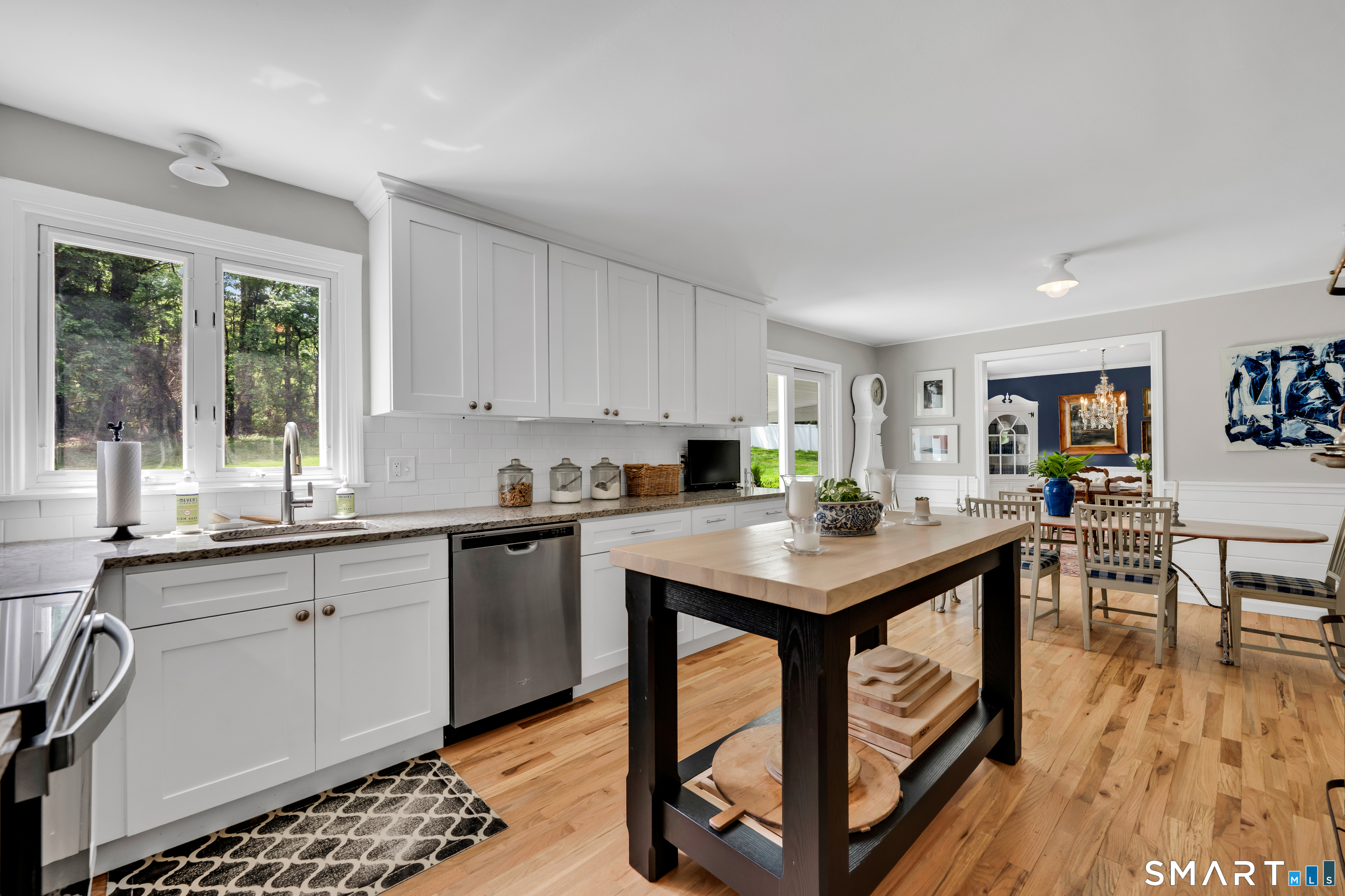 1000 Bassett Road Watertown, CT 06795 - Photo 11 of 35 a kitchen with stainless steel appliances granite countertop a stove top oven a sink dishwasher and cabinets with wooden floor