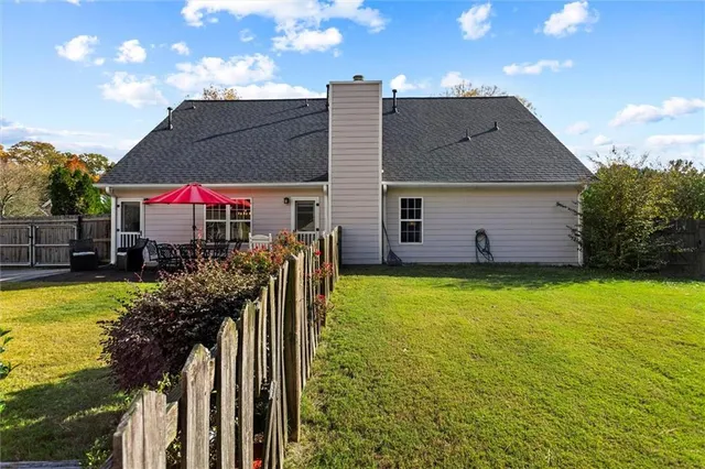 a living room with furniture wooden floor and a fireplace