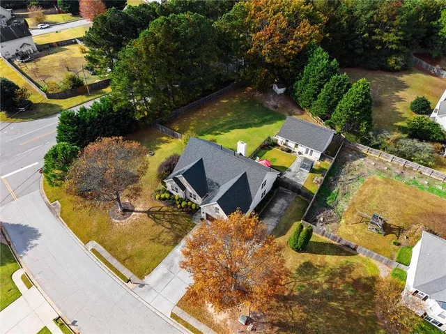 an aerial view of a house with pool patio and outdoor seating