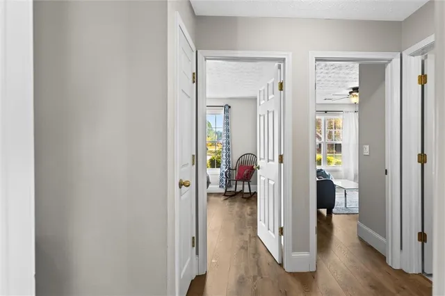 a bathroom with a sink mirror vanity and toilet