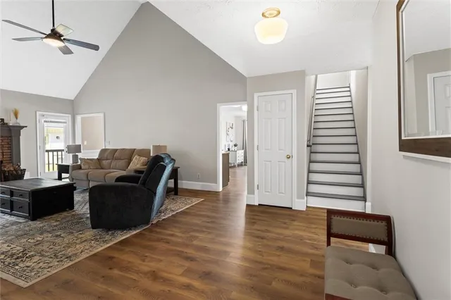 a dining room with furniture a chandelier and window