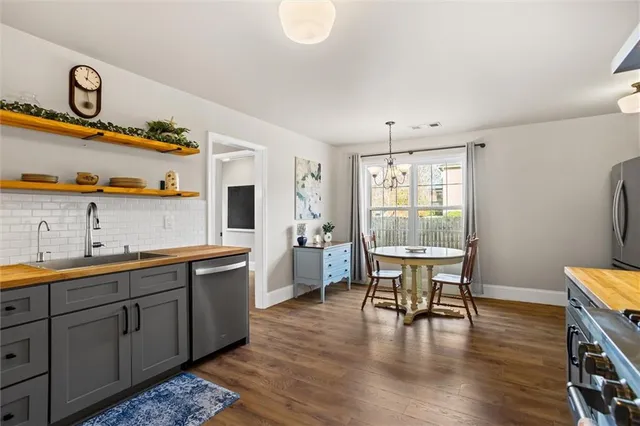 a bedroom with furniture and a flat screen tv