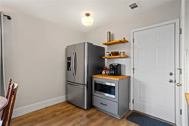 a view of a house with backyard sitting area and garden