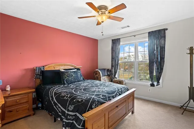 a kitchen with cabinets appliances a sink and a counter top space