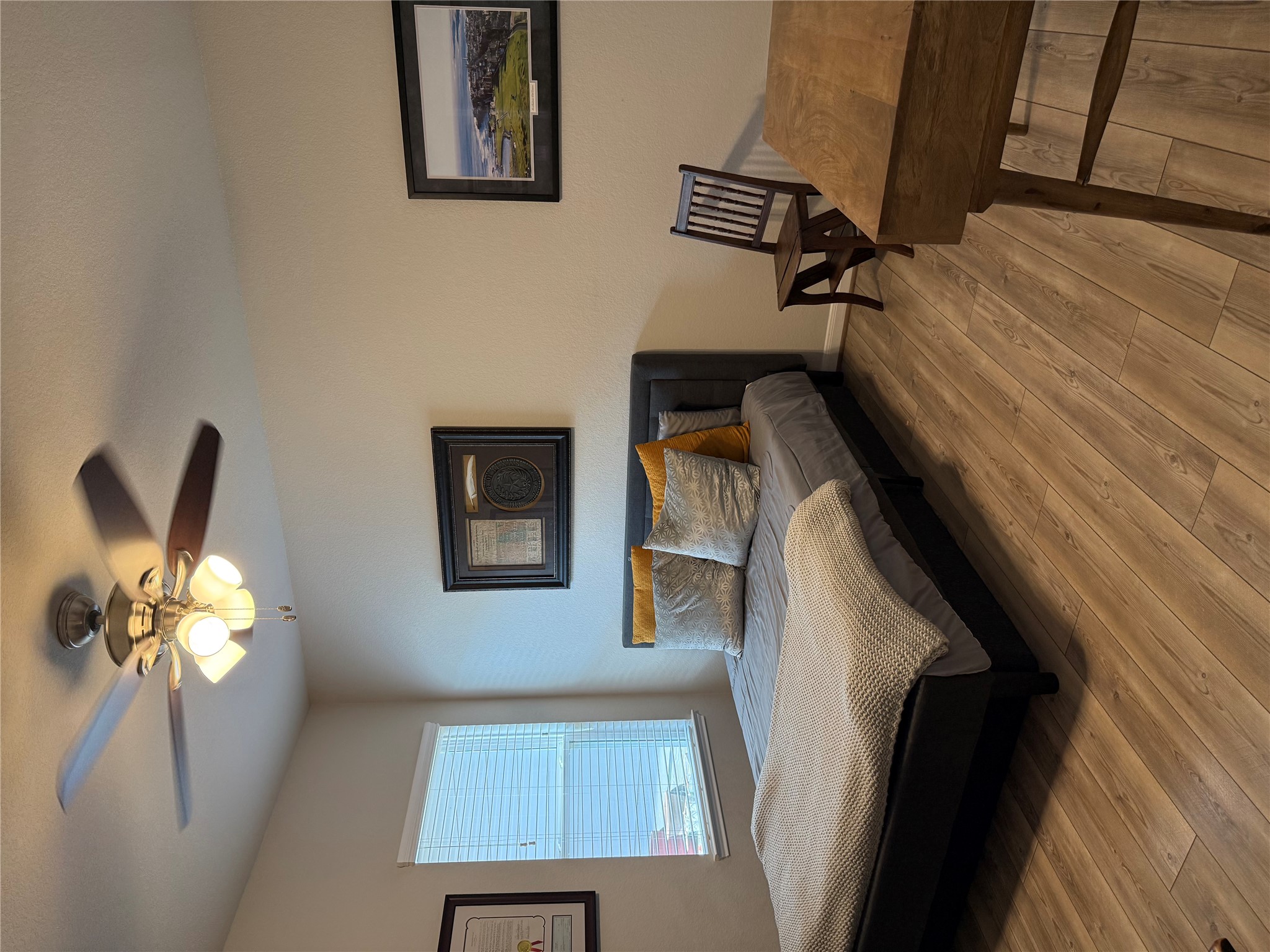 2336 Hagerman Road Conroe, TX 77384 - Photo 14 of 35 a bedroom with a bed and a chandelier