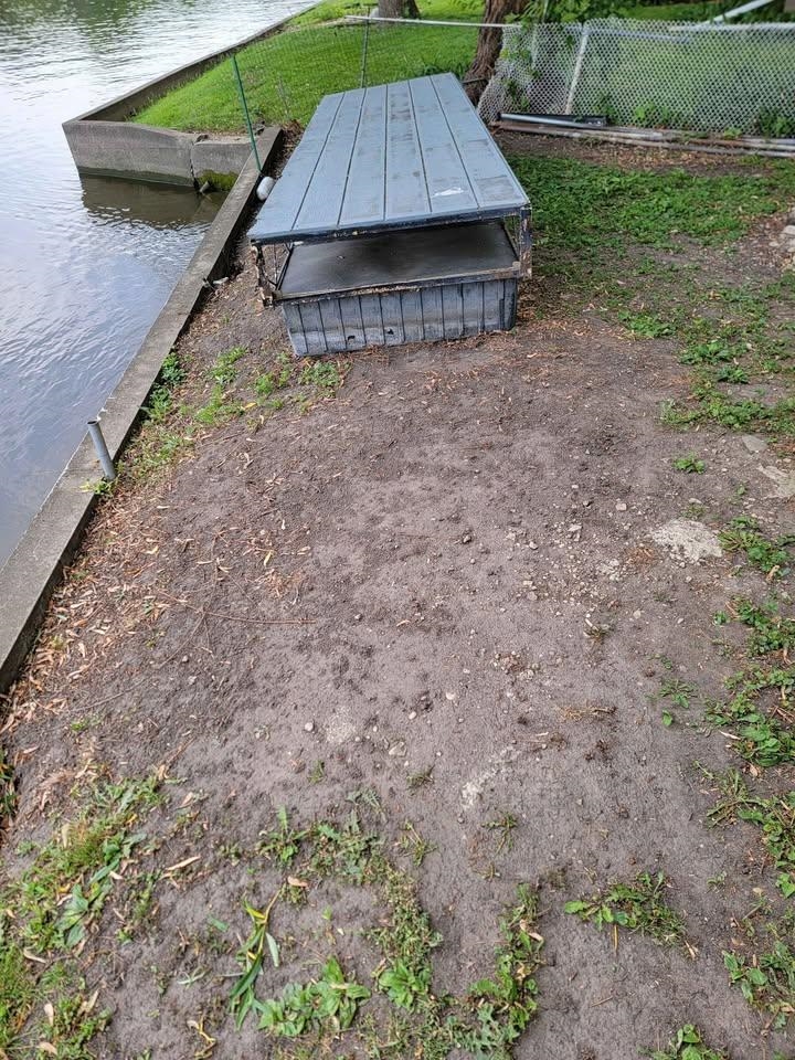 5065 Browns Beach Road Rockford, IL 61103 - Photo 10 of 13 a backyard of a house with table and chairs