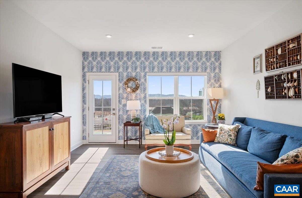 832 Swede Street Charlottesville, VA 22901 - Photo 14 of 57 a living room with furniture a flat screen tv and a large window