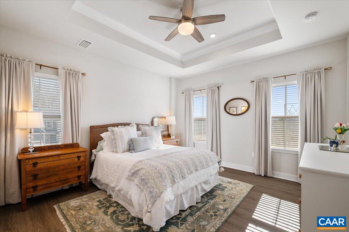 832 Swede Street Charlottesville, VA 22901 - Photo 18 of 57 a bedroom with a bed and a chandelier