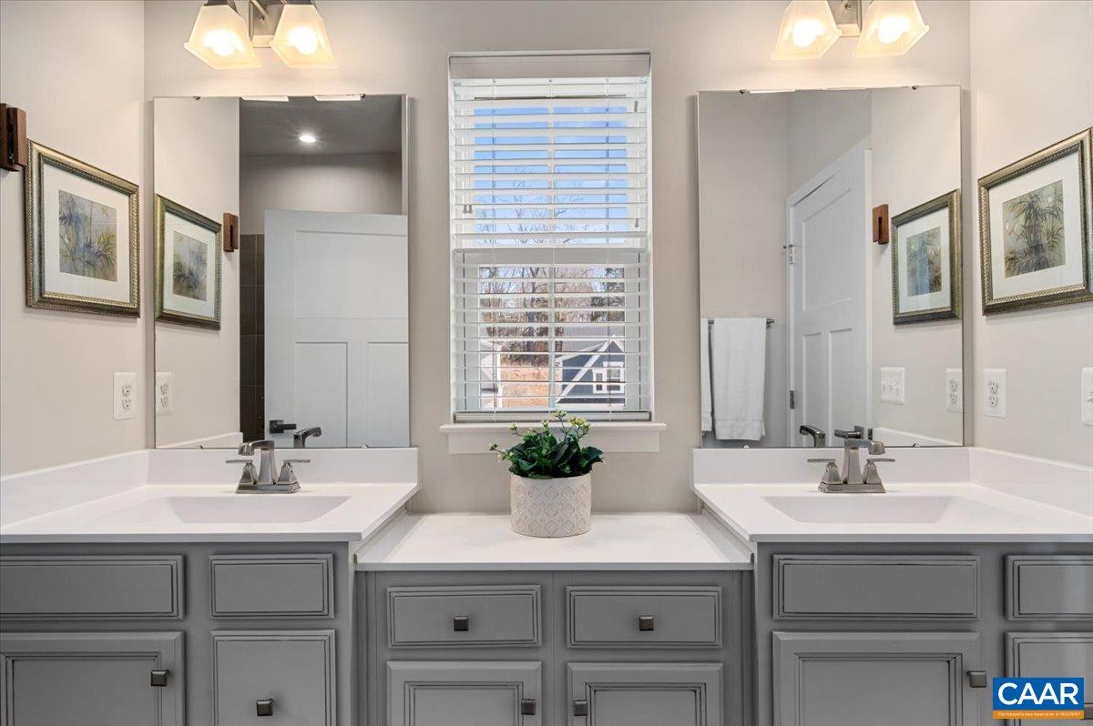 832 Swede Street Charlottesville, VA 22901 - Photo 21 of 57 a bathroom with a sink and a mirror