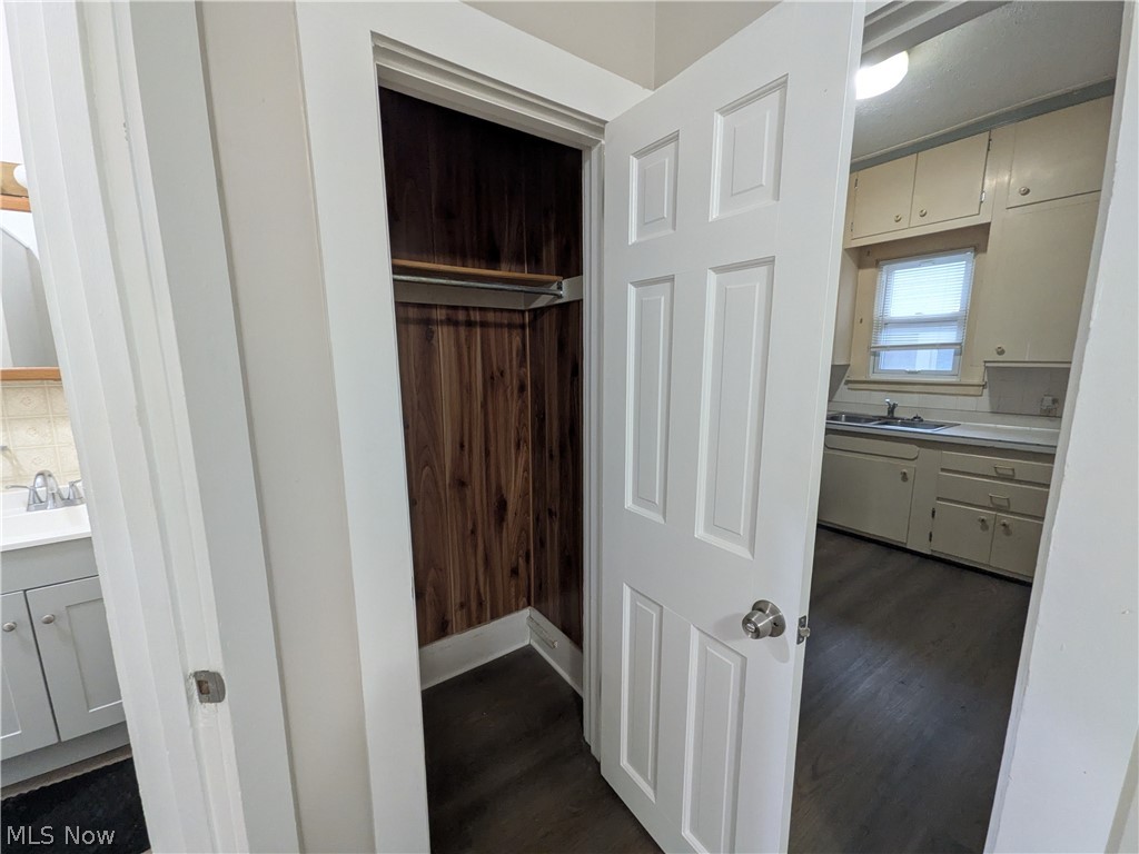 1881 Manchester Road, Unit 1 Akron, OH 44314 - Photo 31 of 44 1881 Manchester Rd, Akron, OH 44314 Unit #1 ground floor access and living. Welcome to this spacious 2-bedroom, 1-bathroom first-floor generous and remodeled apartment in the Kenmore neighborhood of Akron, offering a great amount of comfortable living space. This move-in ready apartment features LVP flooring throughout, a spacious living room, room for dining, separate kitchen with a gas range and stainless steel refrigerator, two bedrooms, and a full private bathroom which has a convenient step-in shower. Large windows provide natural light, while ample closets offer plenty of storage. Enjoy off-street parking and a backyard with a picnic table and small firepit, providing a pleasant outdoor space to relax and enjoy for the buildings tenants.