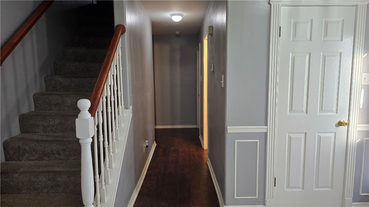 5026 Rasputin Court Corpus Christi, TX 78413 - Photo 15 of 40 a view of a hallway with wooden floor and entryway