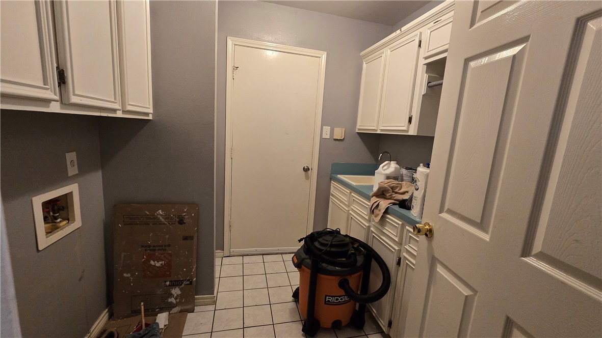 5026 Rasputin Court Corpus Christi, TX 78413 - Photo 28 of 40 a room with storage and utility