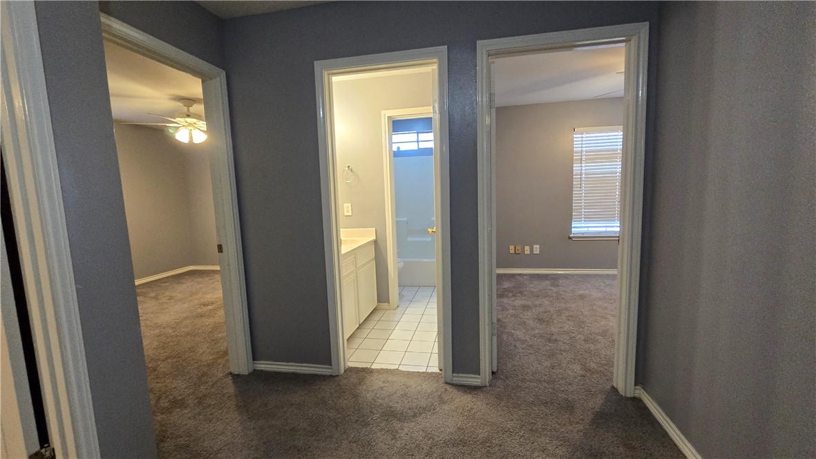 5026 Rasputin Court Corpus Christi, TX 78413 - Photo 30 of 40 an empty room with windows and closet