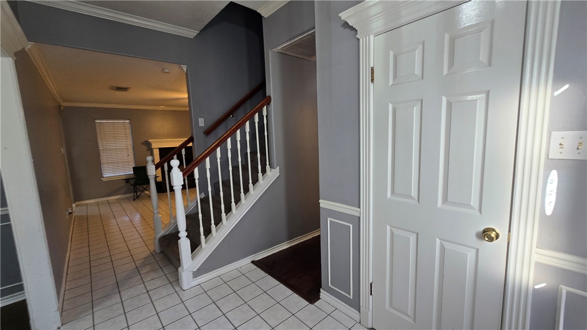 5026 Rasputin Court Corpus Christi, TX 78413 - Photo 4 of 40 a view of entryway with stairs and wooden floor