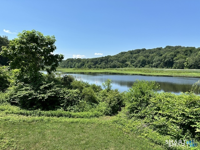 135 Middlesex Avenue Chester, CT 06412 - Photo 1 of 34 a view of a green field with an ocean view