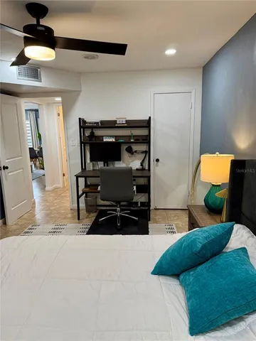 a bedroom with furniture and a dresser