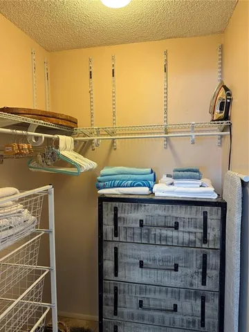 a view of a balcony with a table and chairs