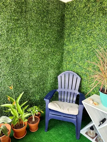a view of a backyard with sitting area
