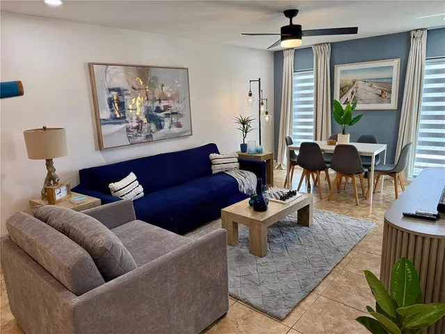 a living room with furniture and a large window